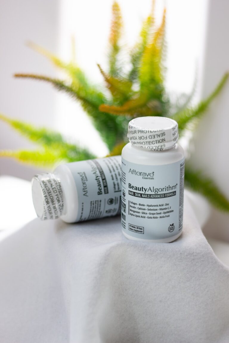 A close up of two bottles of medicine on a table